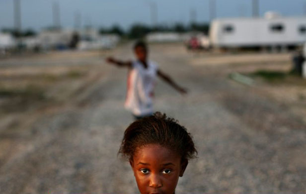 Kimber Smith stands in the FEMA Diamond travel trailer park in Port Sulphur, Louisiana
