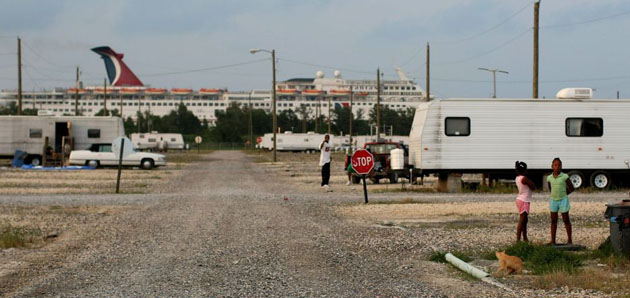 A cruise ship passes the FEMA Diamond travel trailer park.