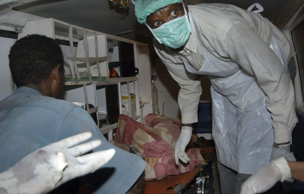 Rescue workers remove bodies from wreckage in Khartoum 