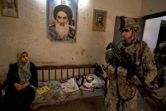 American troops search a house in a Baghdad