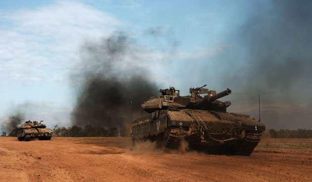 Israeli tanks roll back into Israel after an Israeli army operation in the Gaza Strip.