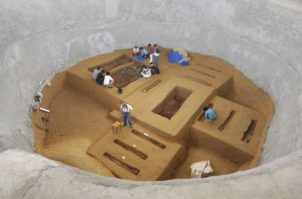 Bangbu, China: Archaeologists at work on the excavation of a recently discovered tomb
