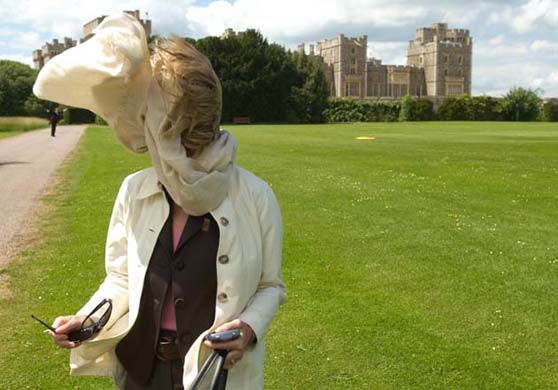 The White House press secretary, Dana Perino, is blasted by wind from Marine One - the US president's helicopter