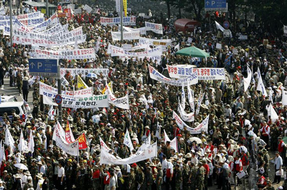 Pro-government South Korean military veterans march through the streets in Seoul 