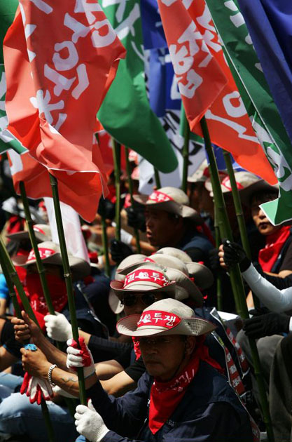Construction workers participate in a general strike rally in Seoul