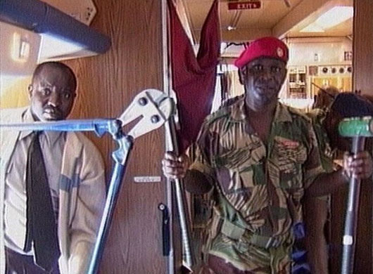  Zimbabwe military officials hold up wire cutters in this video frame grab in Harare