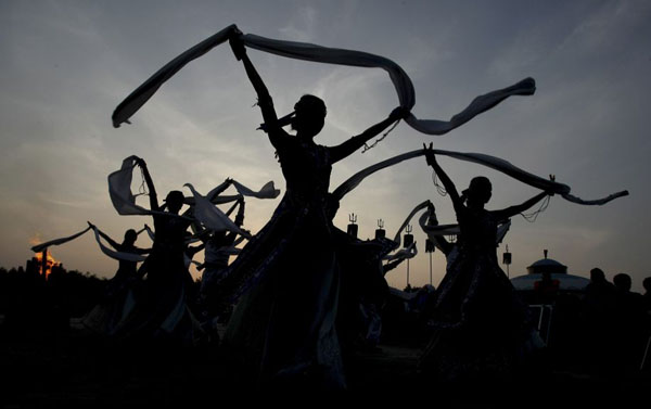 Songyuan, China: Young ethnic Mongolians perform at a tourism festival. Photograph: AP