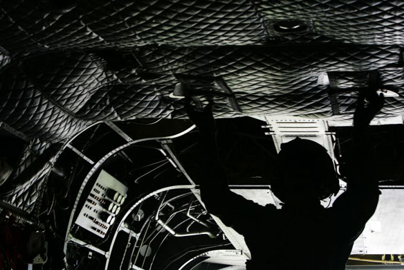 Iowa, US: Staff Sergeant Shad Myers prepares for takeoff in a National Guard helicopter, part of a relief mission for a water treatment facility. Photograph: Courtney Sargent/The Gazette/AP