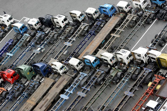 Busan, South Korea: Trucks parked at the city's port; Korean container truck drivers have been on strike, protesting over rising fuel prices. Photograph: Byun Yeong-Wook/AFP/Getty Images