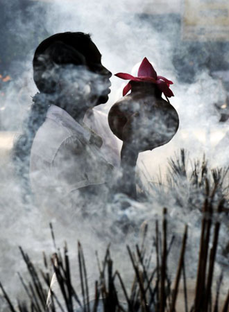ColomboSri Lanka: Devotees offer flowers at a temple