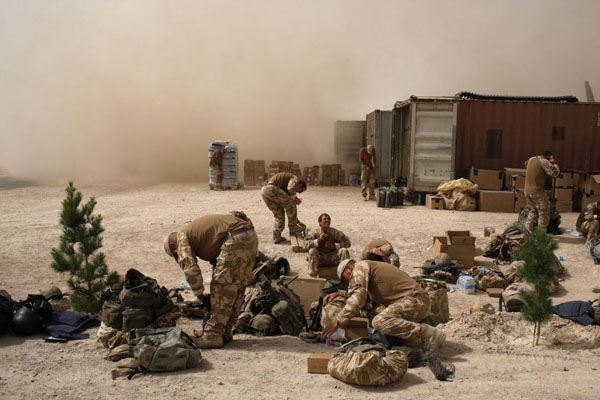 Zabul Province, Afghanistan: British paratrooper wait at Camp Eagle as they prepare to be deployed by Chinook helicopter into Kandahar football stadium