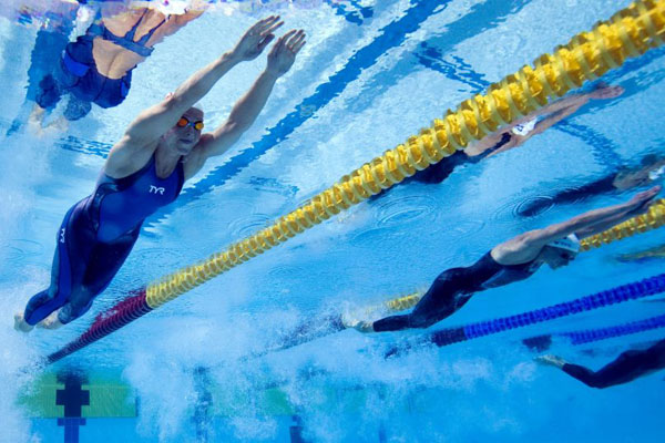 Paris, France:  Aurore Mongel (L) competes in the 100m women's butterfly final of the Paris Swimming Open
