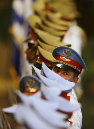 Havana, Cuba: A member of the honour guard looks back before a welcoming ceremony for Uruguay's President Tabare Vazquez at the Revolution palace