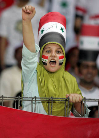 An young Iraqi supporter shouts slogans as he waits for the final match of AFC Asian Cup 2007 between Iraq and Saudi Arabia