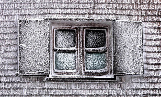 A window covered with ice on the Nebelhorn mountain