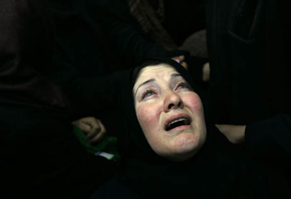 A woman mourns during the funeral for four Palestinian militants