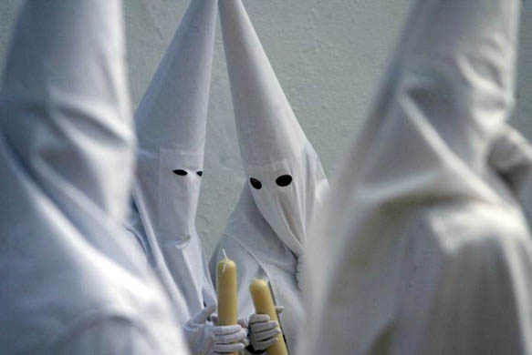 Seville, Spain: Penitents during the procession of the 'La Paz' brotherhood
