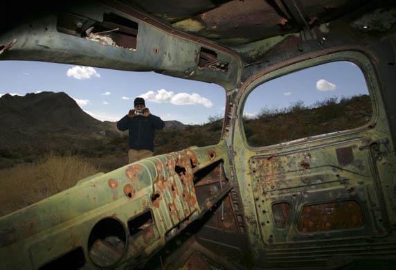 Death Valley National Park, US: Dr Mike Karch takes a photo of an abandoned miner's truck