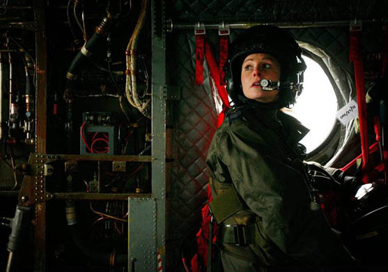 London, UK: Loadmaster Sergeant Liz McConaghy looks out from a helicopter at the RAF Museum