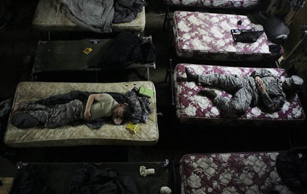 Baghdad, Iraq: U S army soldiers rest in their makeshift barracks at Combat Outpost Rabiy in Mosul
