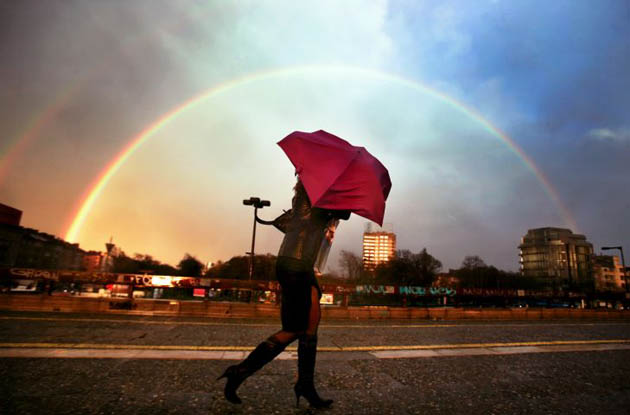 Sofia, Bulgaria: A woman walks past a rainbow