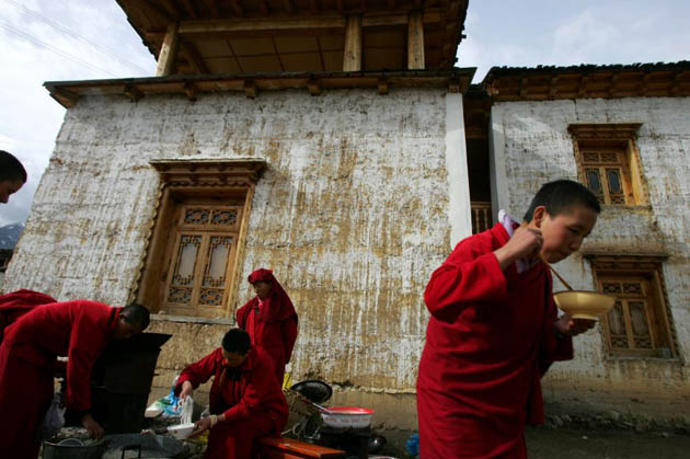 Tibetan nuns prepare breakfast at the Taibaling nunnery