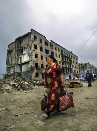 Grozny, Russian Federation: Local residents walk along a street in the city centre