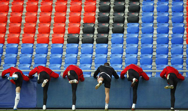 Basel, Germany: Players stretch during a training session