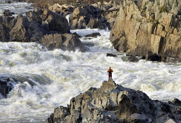 A kayaker enjoys the rushing waters of the Potomac river