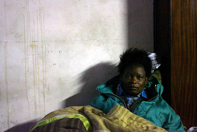 Johannesburg, South Africa: A Zimbabwean refugee takes shelter in a church