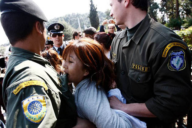 Athens, Greece: Police surround a pro-Tibet protester