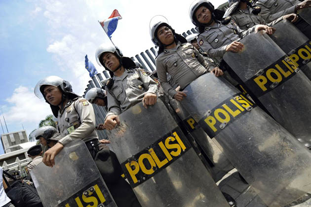 Jakarta, Indonesia: Police erect a human wall in front of the Netherlands embassy