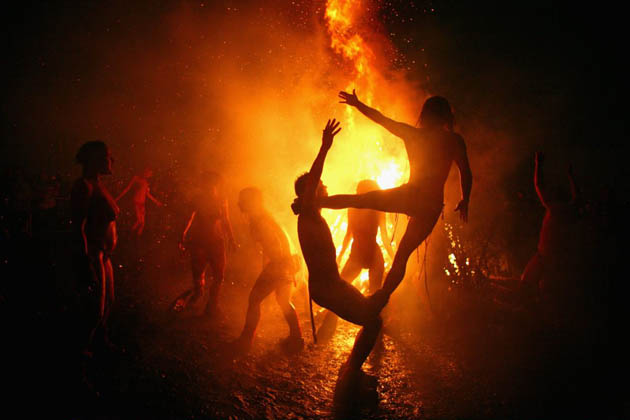 Members of the Beltane Fire Society celebrate the coming of summer by participating in the Beltane Fire Festival on Calton Hill