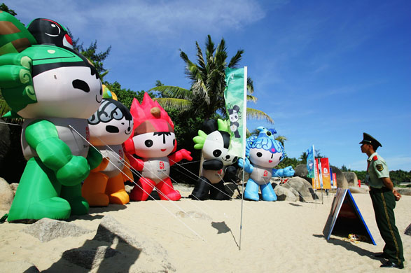 Sanya, China: A policeman on guard duty at the start of the Chinese leg of the Olympic torch relay