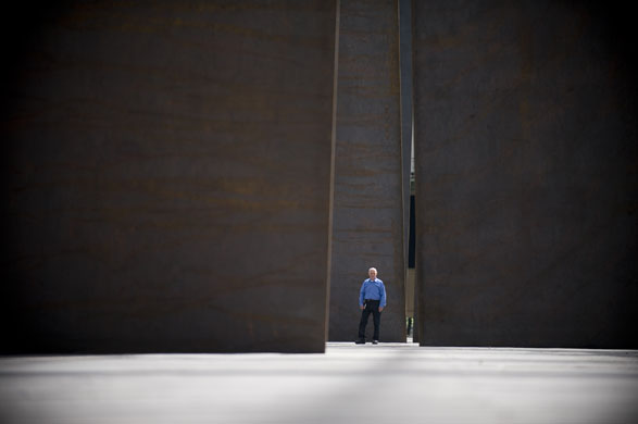 Paris, France: American sculptor Richard Serra poses beside one of his sculptures