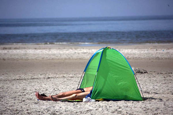 Schleswig-Holstein, Germany: Visitors enjoy the sunny weather at the beach of St Peter-Ording