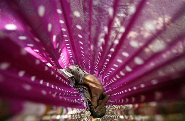 Batticaloa, Sri Lanka: A boy sleeps in a hammock