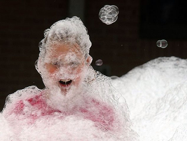 Owensboro, US: Sailor Isbell wades through bubbles at Audubon elementry school