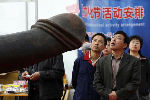 Chinese check out the ancient sex artifacts on display at an exhibition