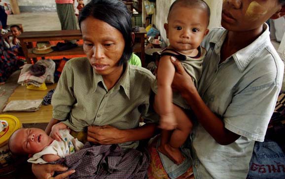 Women and children await aid