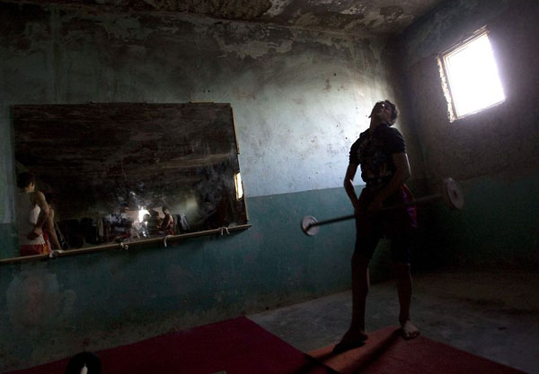 Kabul, Afghanistan: A sportsman exercises at a martial arts club