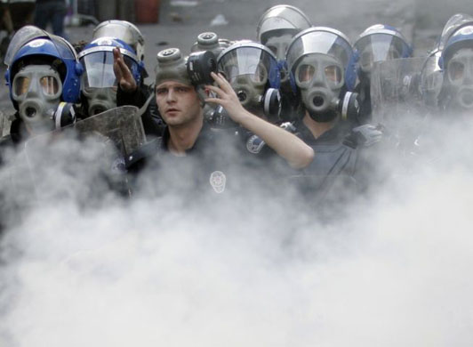 Istanbul, Turkey: Riot police use tear gas to disperse Kurdish protesters during an unauthorized demonstration