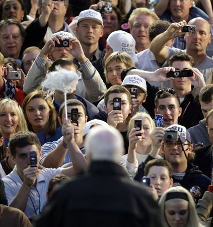 Scranton, US: Members of the crowd photograph John McCain at a rally at the University of Scranton