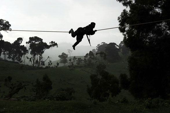 A fighter from the National Congress for the Defense of the People (CNDP) during a military exercise at one of their camp high up in the mountains of North Kivu