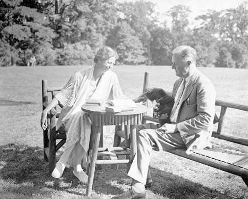 1933: Franklin D Roosevelt and first lady Eleanor relax on the lawn of their estate in Hyde Park with their pet dog Meggie