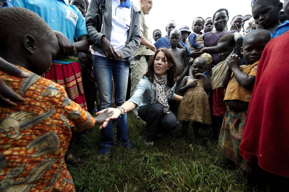 Gulu, Uganda: Denmark's Crown Princess Mary meets with children at the Ongako IDP (Internally Displaced People) camp