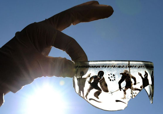 Northumberland: UK: A fragment of Roman glass dating back to the third century, which is one of thousands of artefacts found on the Vindolanda settlement, by Hadrian's Wall