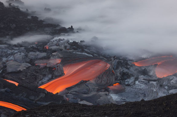 Waikupanaha, Hawaii: After a brief four day hiatus, visible volcanic activity resumes with lava flowing into the sea at the Waikupanaha ocean entry