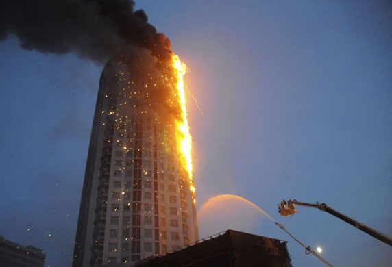 Firemen battle a blaze in a building in Harbin, China 