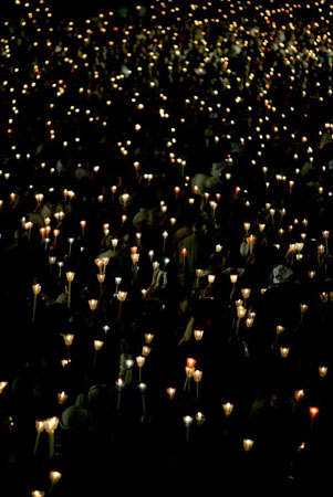 Fatima, Portugal: Pilgrims hold candles during a procession at a Catholic shrine